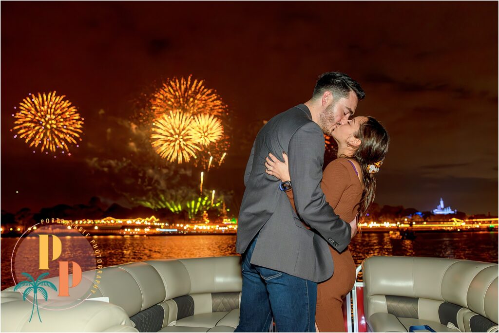 Capturing the joy of a Disney fireworks cruise proposal with the iconic Cinderella Castle lights and fireworks in the background.