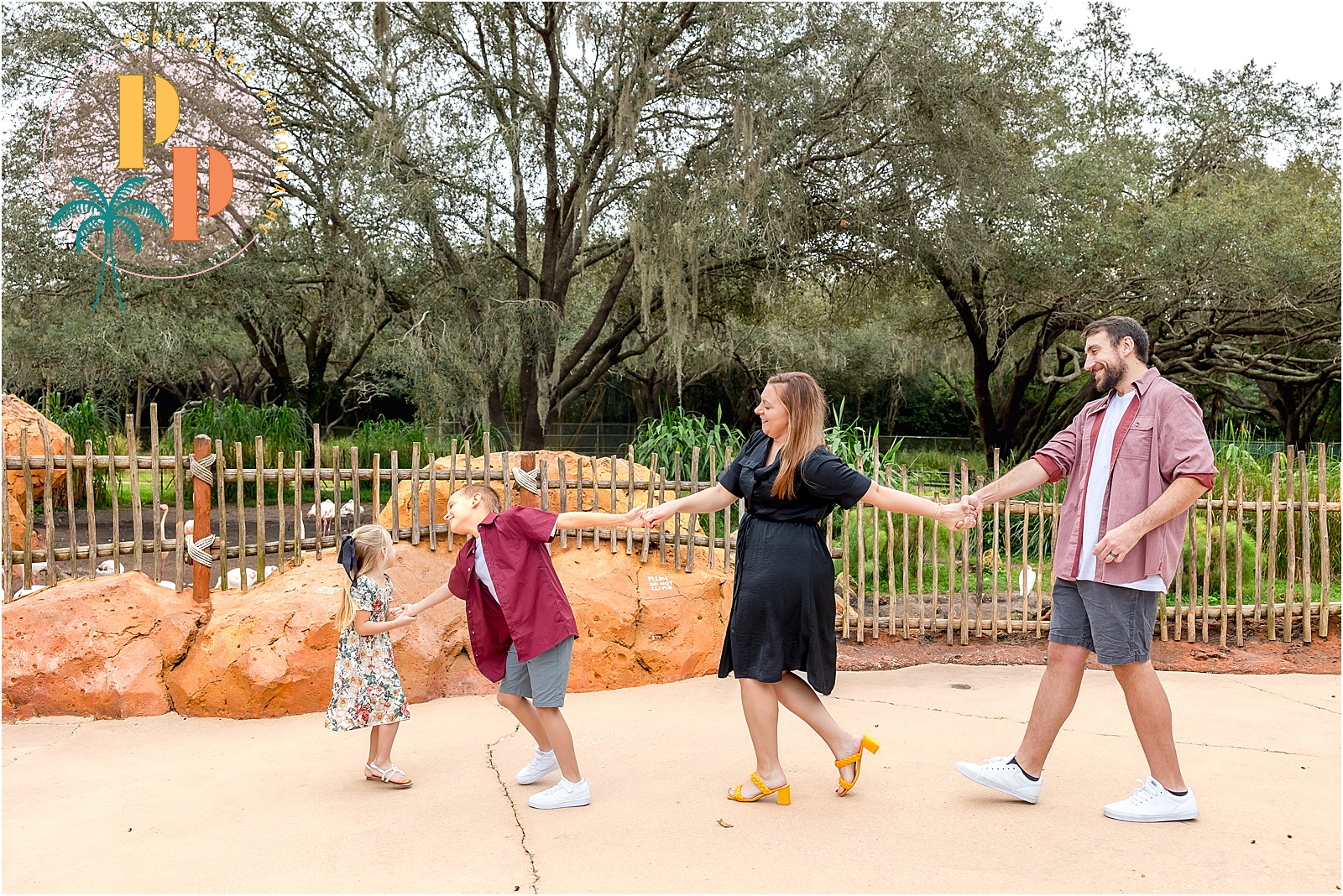 Capturing the magic of Disney-themed family photoshoot ideas at Disney's Animal Kingdom Lodge Resort, the family strolls through the resort's stunning surroundings in safari-inspired elegance. #Disney-themed-Family-Photoshoot-Ideas