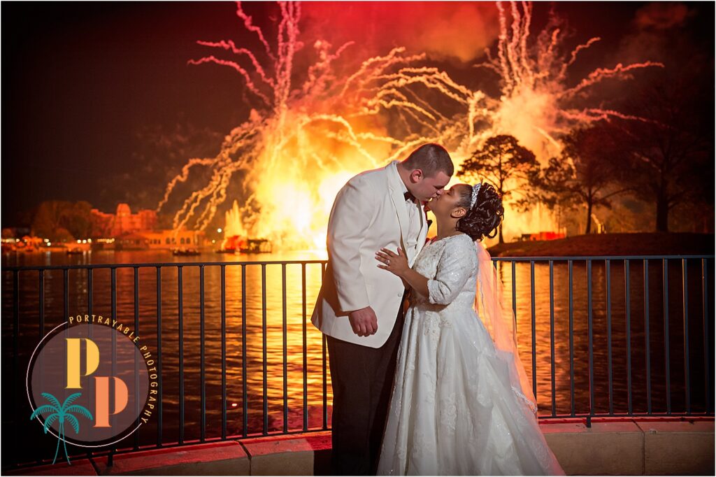 "Documenting portraits at Disneys dessert firework party at Epcot, an outside photographer captures the bride and groom twirling beneath twinkling lights, surrounded by the enchanting ambiance of their Disney wedding.