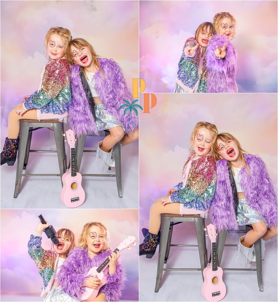 Child posing in front of a vibrant lovers' backdrop with rainbow clouds, inspired by Taylor Swift's whimsical world during a mini photoshoot session.