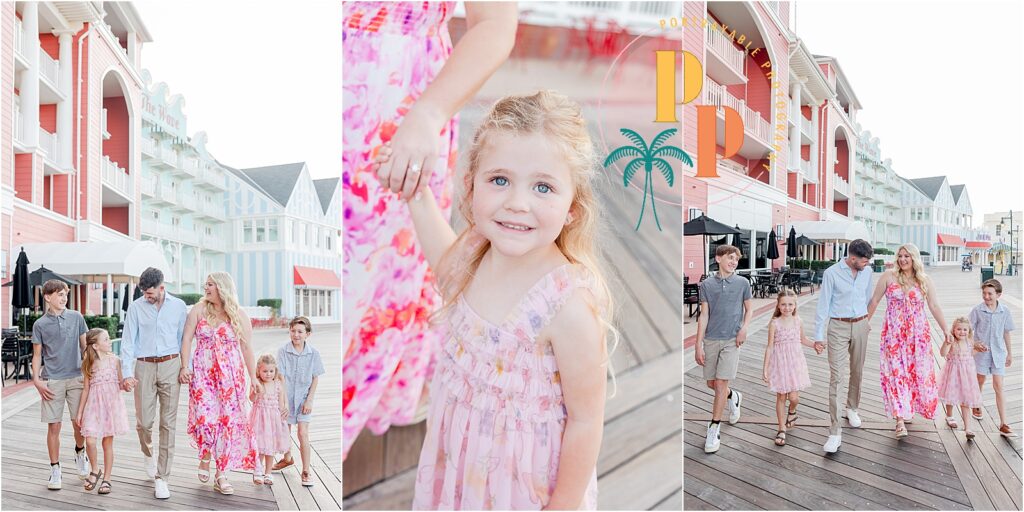 family portraits on the disney boardwalk family is walking hand in hand down the boardwalk by the water