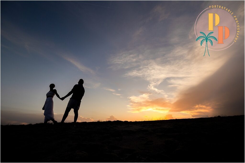 silhouetted photo at sunset on the beach