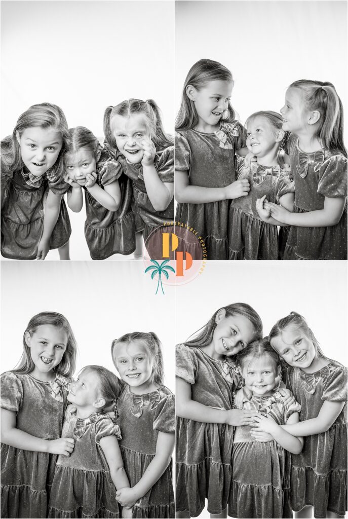  Sibling trio making funny faces in black and white studio photo.
