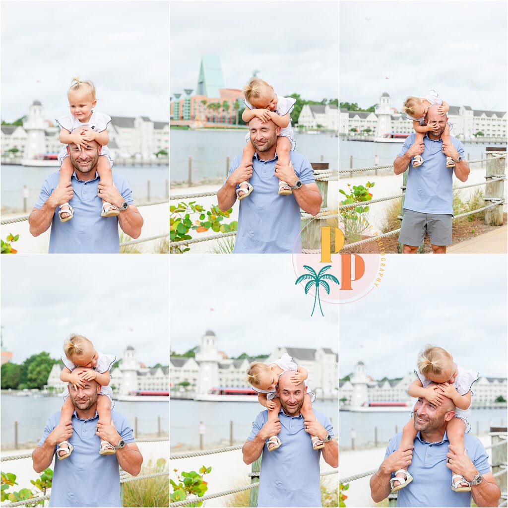 2 year old girl on her dad's shoulders at Disney's resort