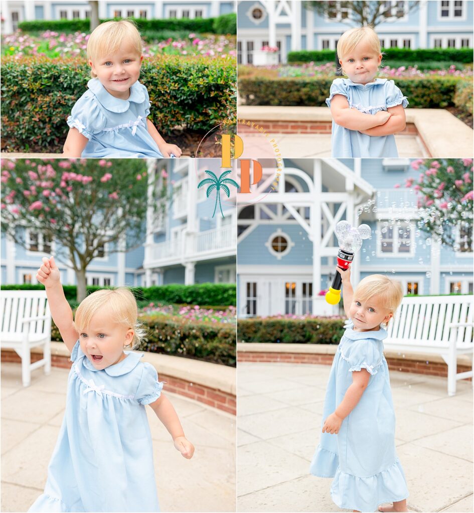 Little girl twirling on the boardwalk in front of the colorful Beach Club buildings
