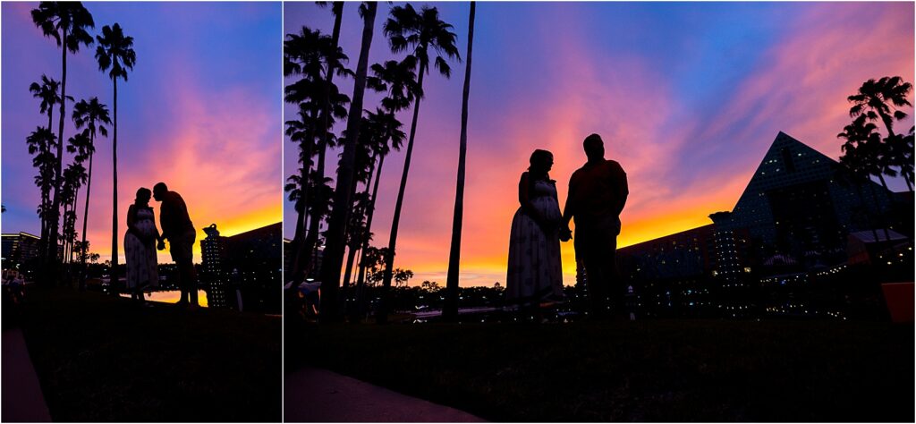 Pregnant woman standing under palm trees at Disney resort