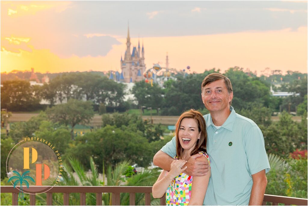 Group photo with Cinderella Castle in the distance, taken from the 4th floor of the resort